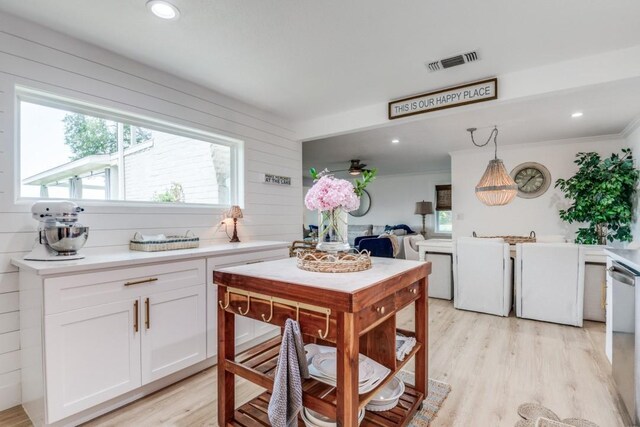 105 Causeway Ct, Gun Barrel City, TX 75156 - kitchen featuring white cabinetry, light countertops, light wood-type flooring, stainless steel dishwasher, and recessed lighting