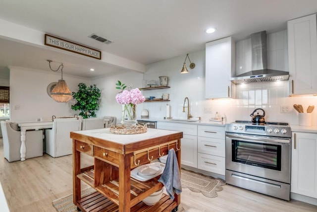 105 Causeway Ct, Gun Barrel City, TX 75156 - kitchen featuring appliances with stainless steel finishes, wall chimney exhaust hood, backsplash, white cabinets, and recessed lighting