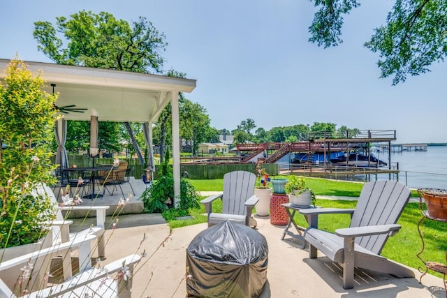 105 Causeway Ct, Gun Barrel City, TX 75156 - view of patio featuring an outdoor fire pit, a water view, a boat dock, and grilling area