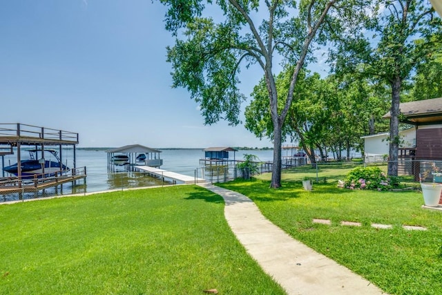 105 Causeway Ct, Gun Barrel City, TX 75156 - dock area with boat lift, a water view, and a yard