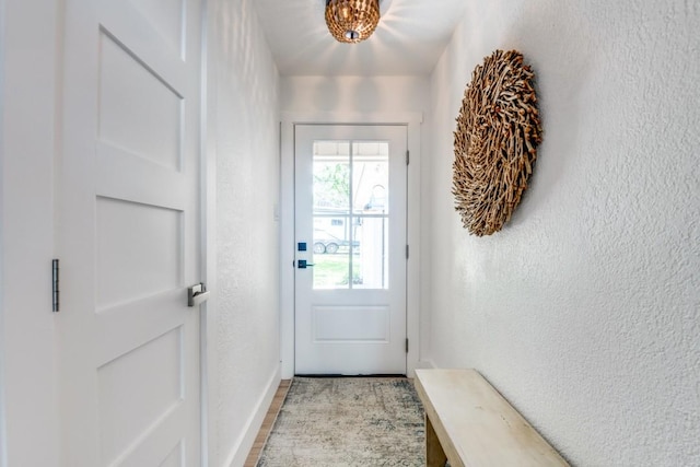 105 Causeway Ct, Gun Barrel City, TX 75156 - doorway with a textured wall and wood finished floors