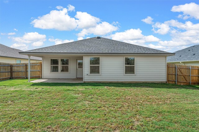 6941 Guadalupe Rd, China Spring, TX 76633 - rear view of property featuring a patio, a fenced backyard, and a shingled roof