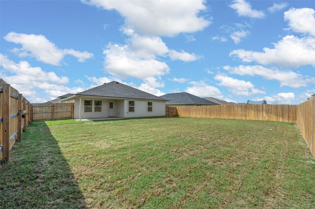 6941 Guadalupe Rd, China Spring, TX 76633 - rear view of house with a fenced backyard