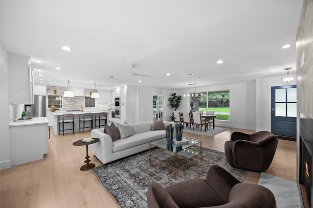 7150 Blairview Dr, Dallas, TX 75230 - living room featuring recessed lighting, light wood-style flooring, and a ceiling fan