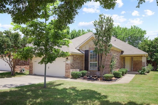733 Atascosa Ave, Fort Worth, TX 76120 - view of front facade featuring brick siding, driveway, and a front yard