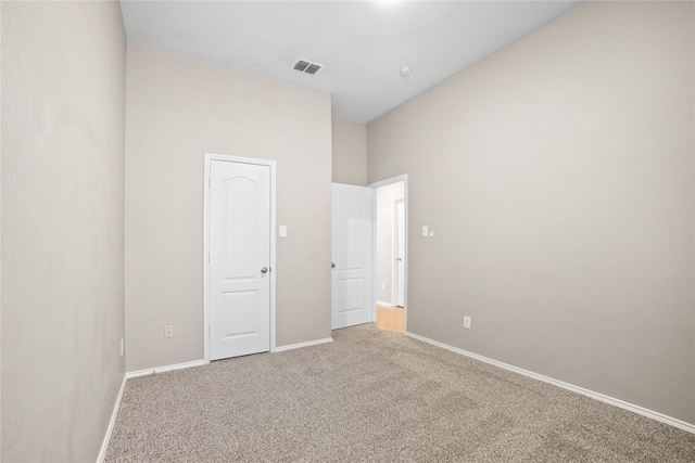 733 Atascosa Ave, Fort Worth, TX 76120 - unfurnished bedroom featuring light colored carpet and a towering ceiling