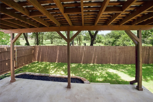 733 Atascosa Ave, Fort Worth, TX 76120 - fenced backyard with a patio area