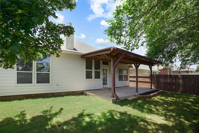 733 Atascosa Ave, Fort Worth, TX 76120 - back of house featuring a patio area and a chimney