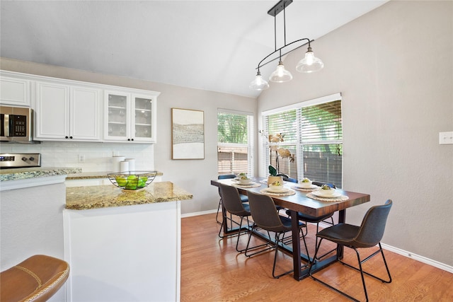 733 Atascosa Ave, Fort Worth, TX 76120 - dining space featuring light wood-style floors and lofted ceiling