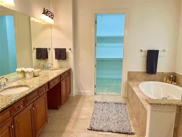1413 Discovery Bay Dr, Frisco, TX 75036 - bathroom featuring a garden tub, double vanity, and tile patterned floors