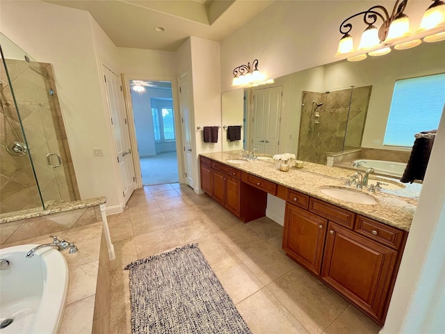 1413 Discovery Bay Dr, Frisco, TX 75036 - full bath featuring a stall shower, double vanity, a bath, and tile patterned floors