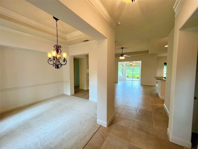 1413 Discovery Bay Dr, Frisco, TX 75036 - corridor featuring a raised ceiling, ornamental molding, a chandelier, light tile patterned floors, and light carpet