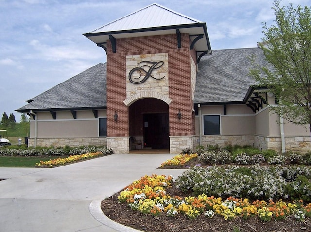 1413 Discovery Bay Dr, Frisco, TX 75036 - view of front of home with stone siding, roof with shingles, and stucco siding