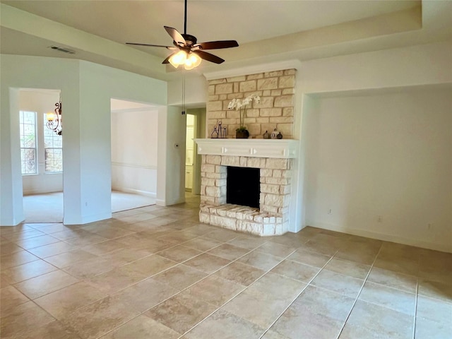 1413 Discovery Bay Dr, Frisco, TX 75036 - unfurnished living room featuring ceiling fan, light tile patterned floors, a chandelier, and a large fireplace