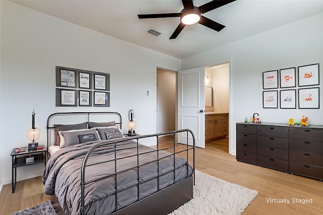 2955 Las Campanas Dr, Farmers Branch, TX 75234 - bedroom with light wood finished floors, ensuite bathroom, and ceiling fan