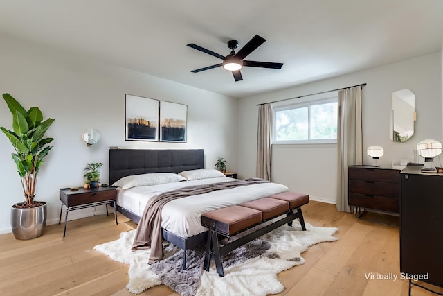 2955 Las Campanas Dr, Farmers Branch, TX 75234 - bedroom featuring light wood-style flooring and a ceiling fan