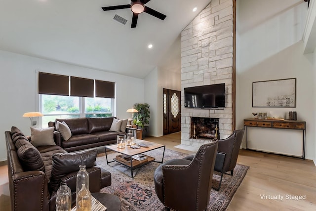 2955 Las Campanas Dr, Farmers Branch, TX 75234 - living area featuring a ceiling fan, a fireplace, high vaulted ceiling, wood finished floors, and recessed lighting
