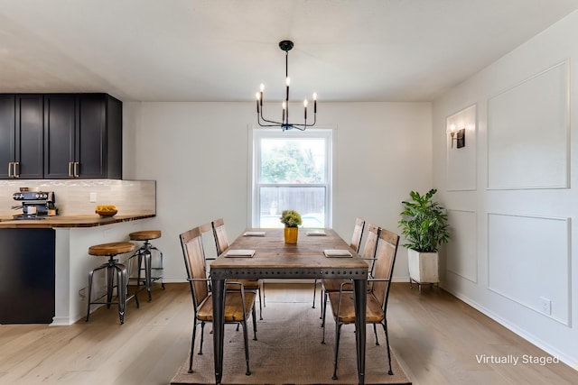 2955 Las Campanas Dr, Farmers Branch, TX 75234 - dining room with light wood-type flooring and a chandelier