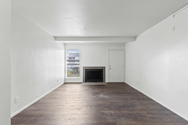 5500 Boca Raton Blvd Unit 327, Fort Worth, TX 76112 - unfurnished living room with dark wood-type flooring and a fireplace