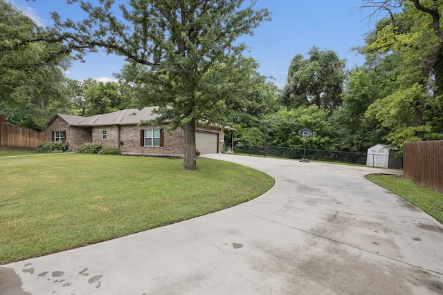 149 Ty Ln, Azle, TX 76020 - view of front of house with concrete driveway, a storage unit, a garage, and brick siding