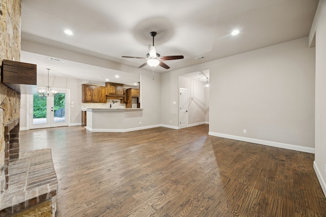 149 Ty Ln, Azle, TX 76020 - unfurnished living room featuring a ceiling fan, dark wood finished floors, a fireplace, recessed lighting, and a chandelier
