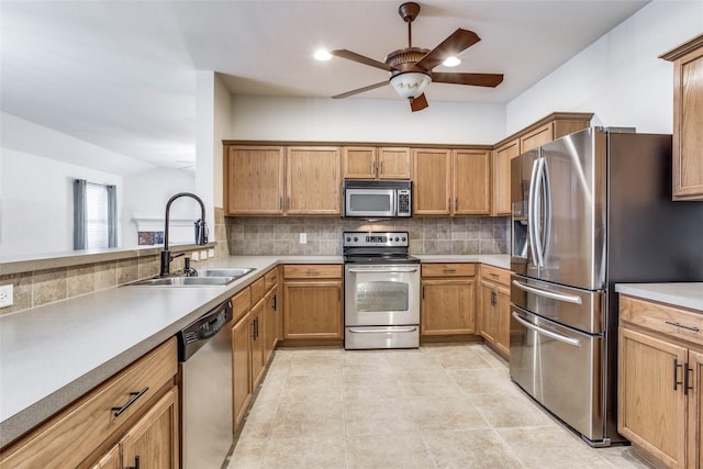 205 Bear Trl, Waxahachie, TX 75165 - kitchen with stainless steel appliances, tasteful backsplash, a ceiling fan, light countertops, and brown cabinetry