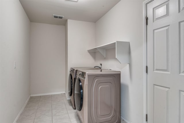 721 Brockwell Bnd, Forney, TX 75126 - washroom featuring washing machine and dryer and light tile patterned floors