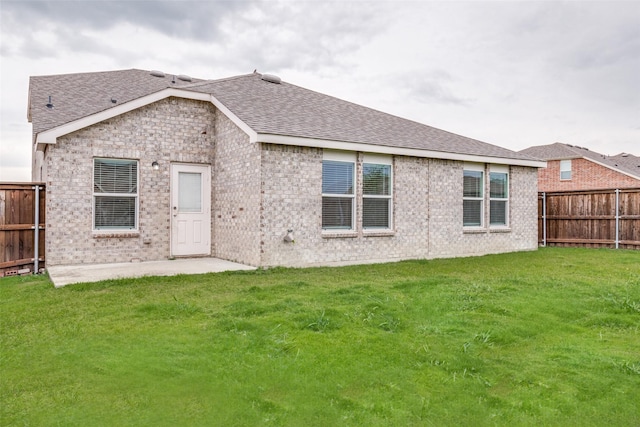 721 Brockwell Bnd, Forney, TX 75126 - back of property featuring brick siding, a fenced backyard, and a shingled roof