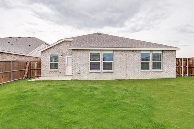 721 Brockwell Bnd, Forney, TX 75126 - back of house with brick siding, a fenced backyard, a patio, and roof with shingles