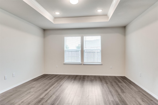 721 Brockwell Bnd, Forney, TX 75126 - unfurnished room with crown molding, a tray ceiling, and wood finished floors