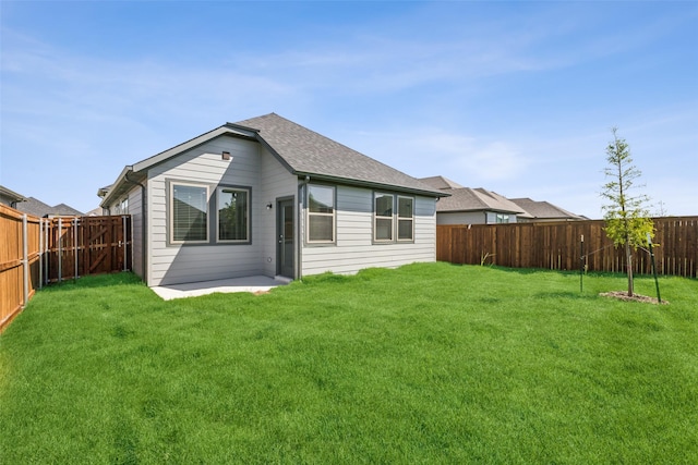 923 Hazel Dr, Lavon, TX 75166 - back of house with a fenced backyard, roof with shingles, and a patio area