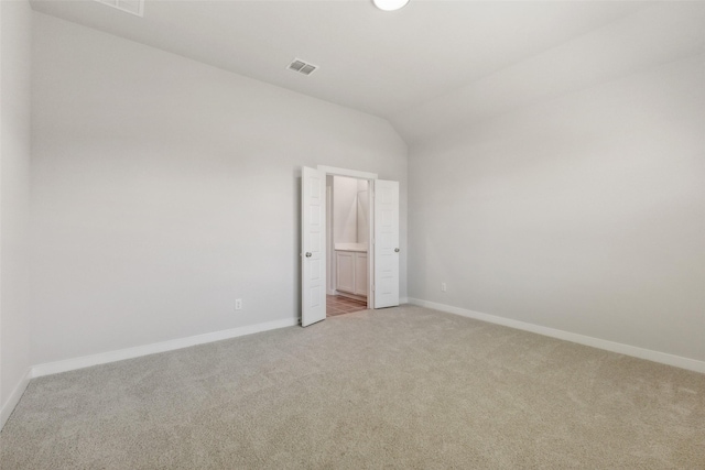 923 Hazel Dr, Lavon, TX 75166 - unfurnished bedroom with light colored carpet, vaulted ceiling, and ensuite bath