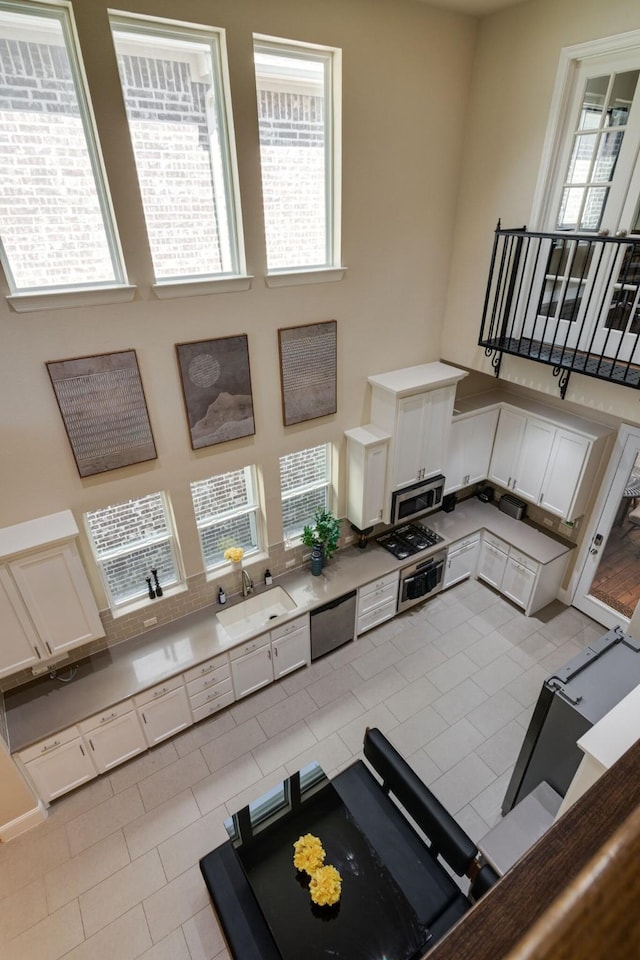 354 Loma Alta Dr, Flower Mound, TX 75022 - living room with a towering ceiling and light tile patterned flooring