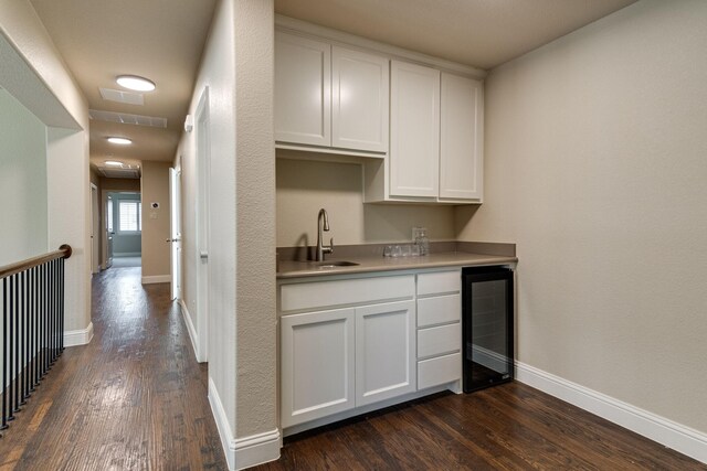 354 Loma Alta Dr, Flower Mound, TX 75022 - indoor wet bar with beverage cooler and dark wood-style flooring