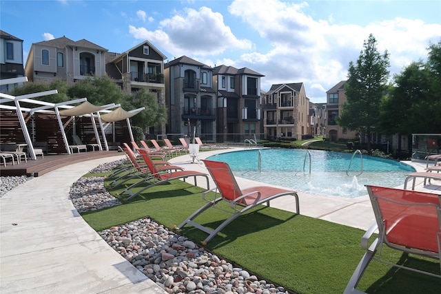 8327 Nunley Ln, Dallas, TX 75231 - community pool with a residential view, a lawn, and a deck
