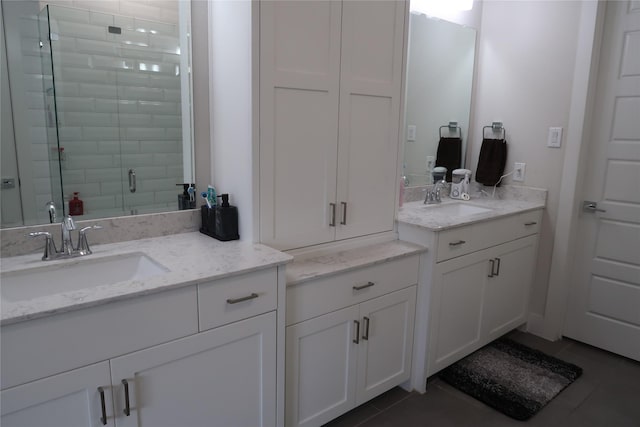 8327 Nunley Ln, Dallas, TX 75231 - bathroom with two vanities, a stall shower, and tile patterned flooring