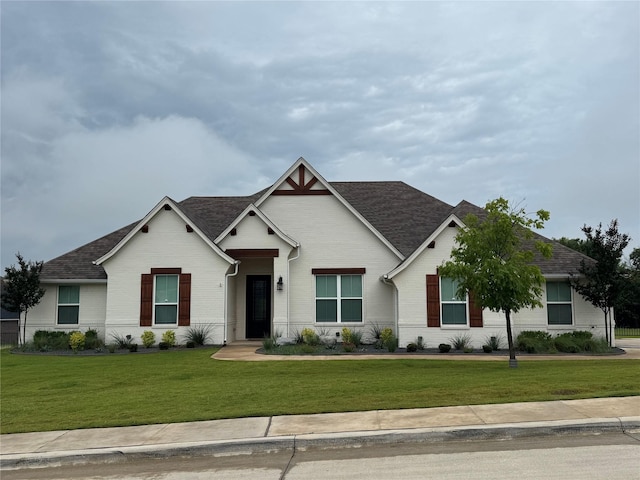 3324 Acorn Hill Trl, Weatherford, TX 76087 - view of front of house with brick siding, a front lawn, and a shingled roof