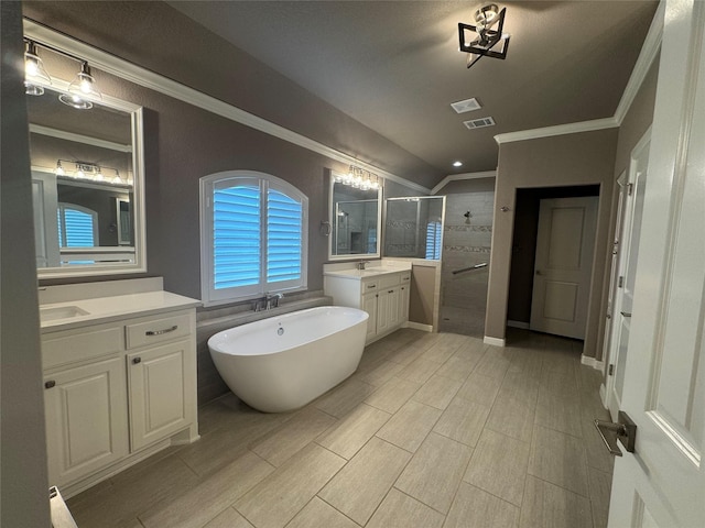 3324 Acorn Hill Trl, Weatherford, TX 76087 - bathroom featuring crown molding, a shower stall, two vanities, lofted ceiling, and a soaking tub