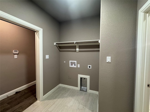 3324 Acorn Hill Trl, Weatherford, TX 76087 - laundry room with hookup for an electric dryer, wood finish floors, hookup for a washing machine, and gas dryer hookup
