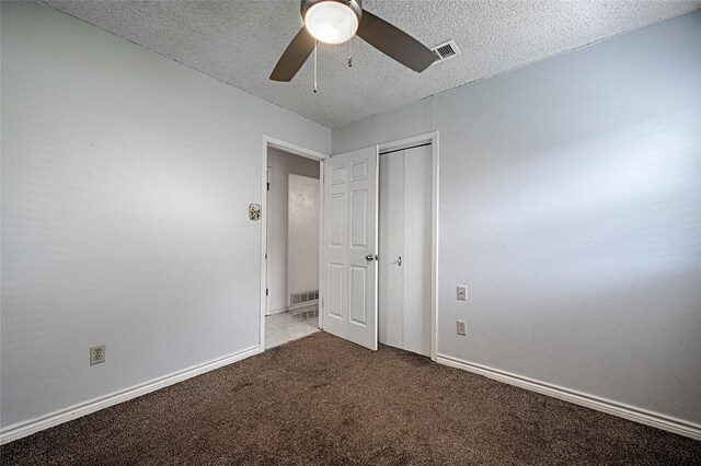 1803 Windsor Dr, Arlington, TX 76012 - unfurnished bedroom with carpet, a textured ceiling, ceiling fan, and a closet