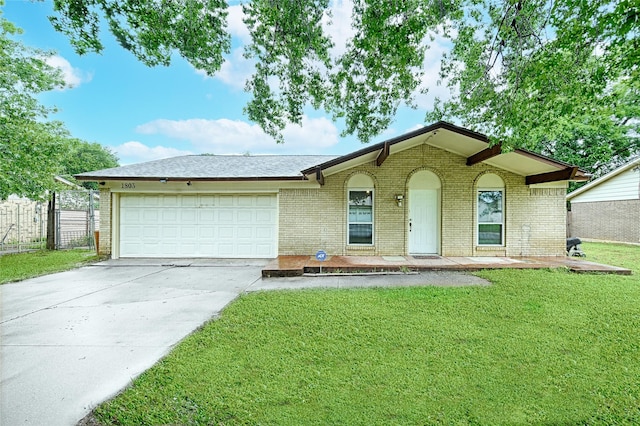 1803 Windsor Dr, Arlington, TX 76012 - ranch-style home featuring brick siding, a garage, and driveway