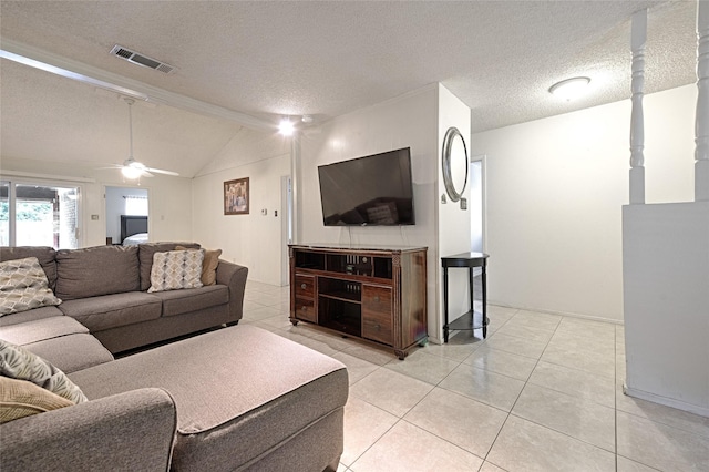 1803 Windsor Dr, Arlington, TX 76012 - living room featuring lofted ceiling, light tile patterned floors, a textured ceiling, and ceiling fan