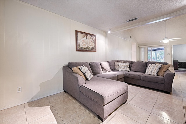 1803 Windsor Dr, Arlington, TX 76012 - living area with a textured ceiling, light tile patterned floors, lofted ceiling, a ceiling fan, and ornamental molding