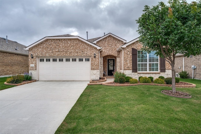 8031 Reservoir Dr, Frisco, TX 75036 - view of front of home with stone siding, a garage, driveway, a front lawn, and brick siding
