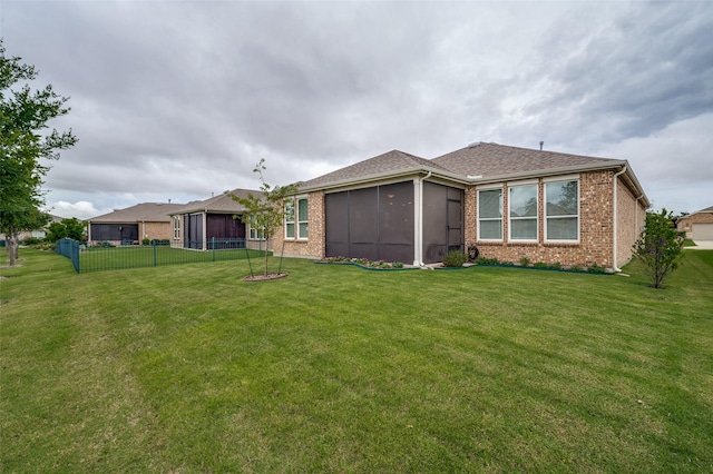 8031 Reservoir Dr, Frisco, TX 75036 - back of property featuring a sunroom and brick siding
