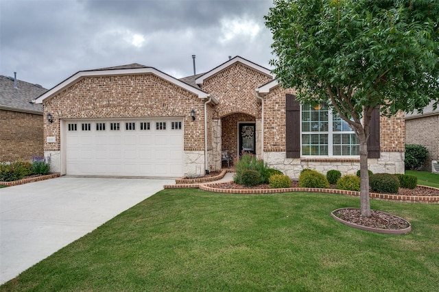 8031 Reservoir Dr, Frisco, TX 75036 - view of front of home featuring a garage, stone siding, concrete driveway, a front lawn, and brick siding