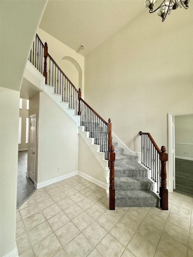 14641 Turnbridge Dr, Frisco, TX 75035 - stairway featuring tile patterned flooring and a high ceiling