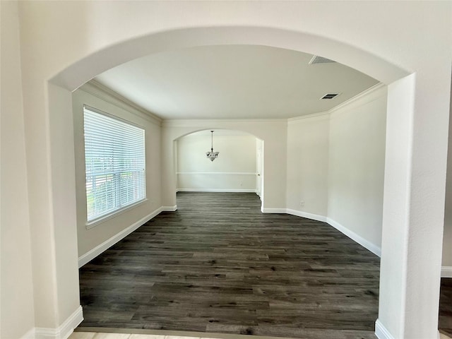 14641 Turnbridge Dr, Frisco, TX 75035 - spare room featuring arched walkways, dark wood-style floors, and ornamental molding