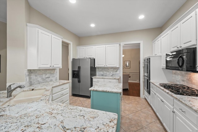 3102 Hidden Springs Dr, Corinth, TX 76210 - kitchen featuring black appliances, backsplash, recessed lighting, white cabinetry, and light stone countertops