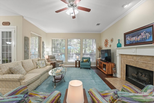 3102 Hidden Springs Dr, Corinth, TX 76210 - living room featuring ceiling fan, ornamental molding, a fireplace, and wood finished floors